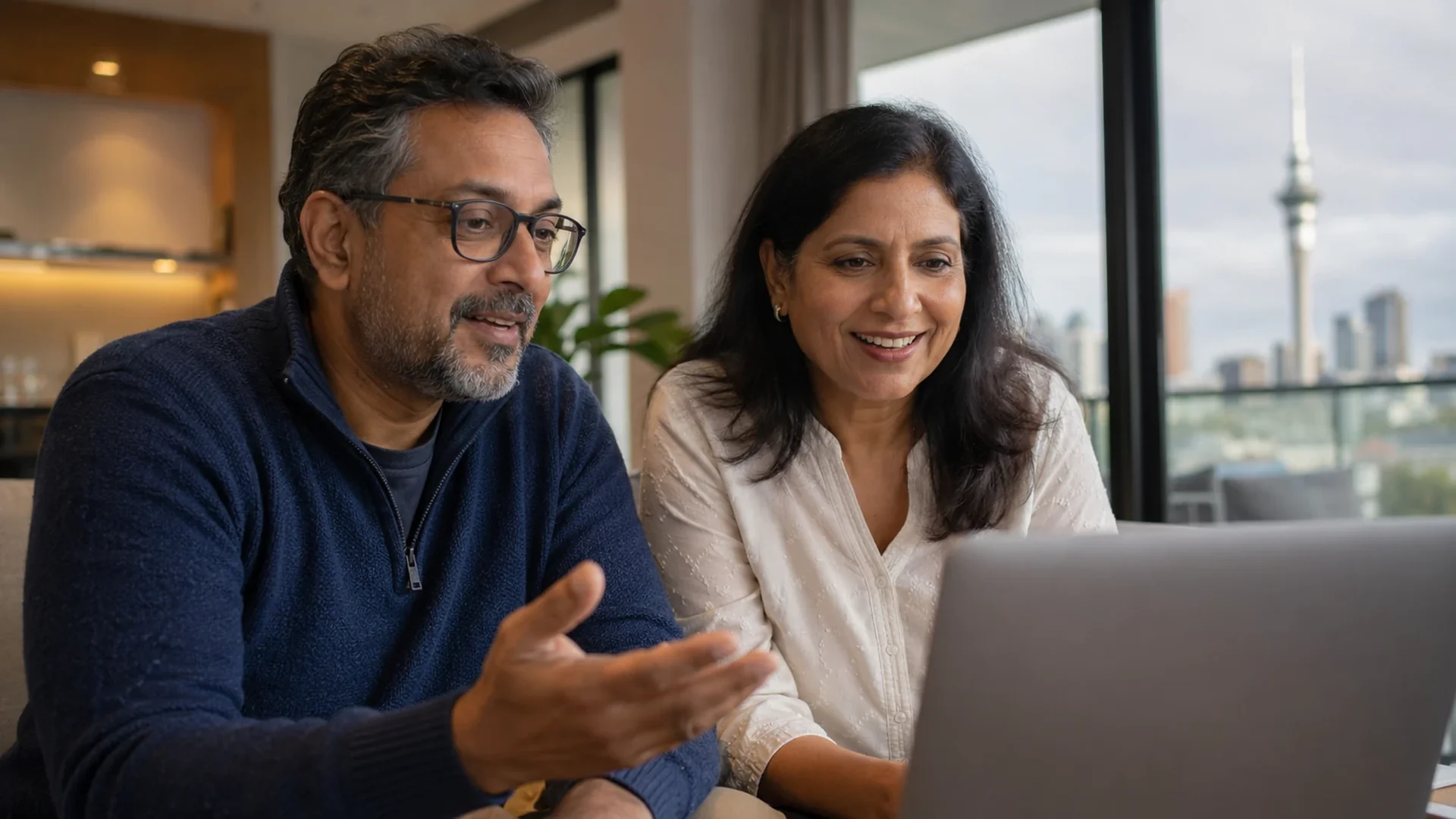A New Zealand couple in an online relationship counselling session at home