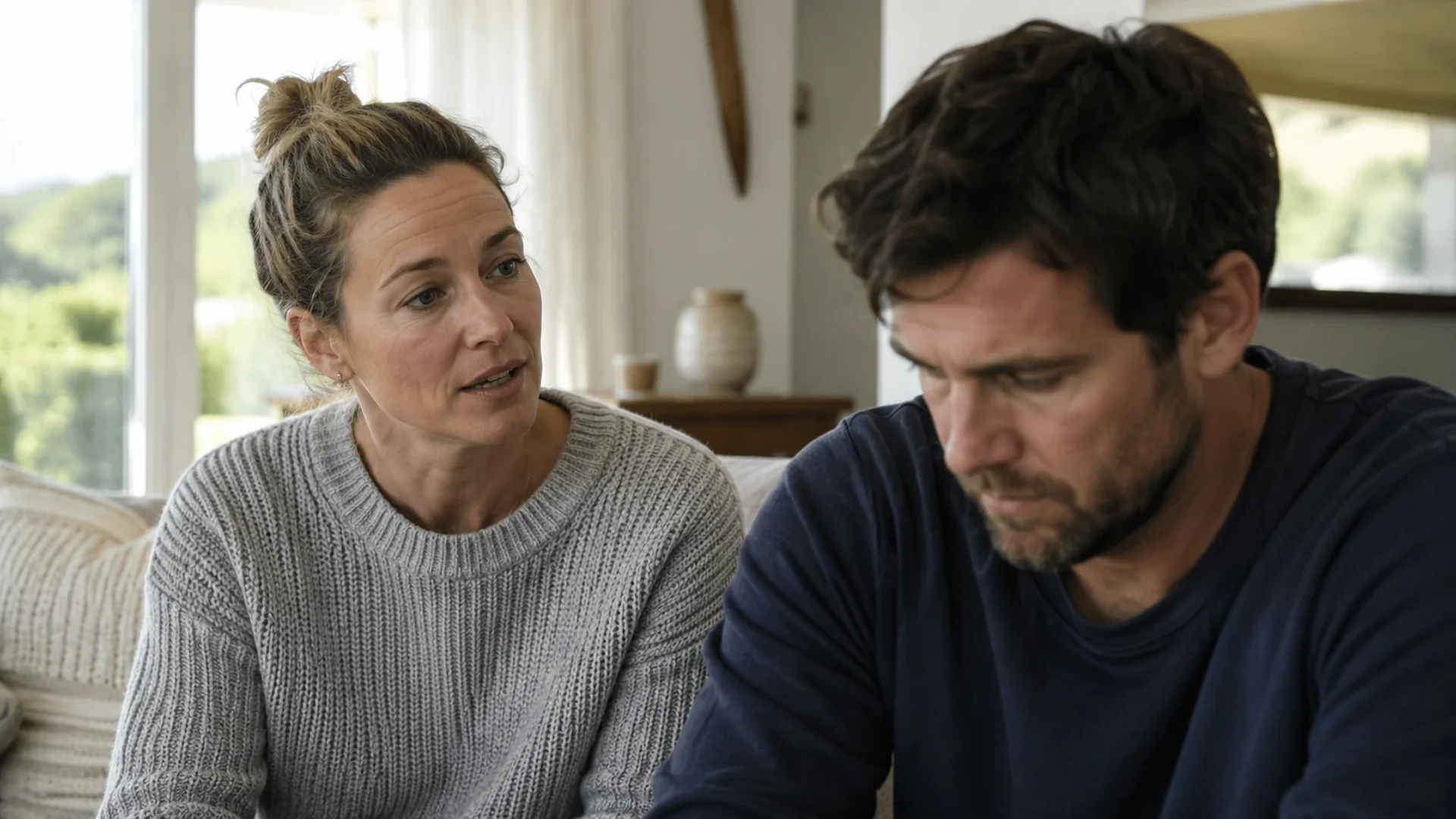 Woman speaking while her husband looks away, disconnection visible